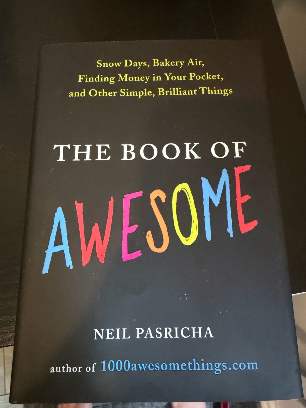 The Book of Awesome by Neil Pasricha - Black Cover with Multicolor Title